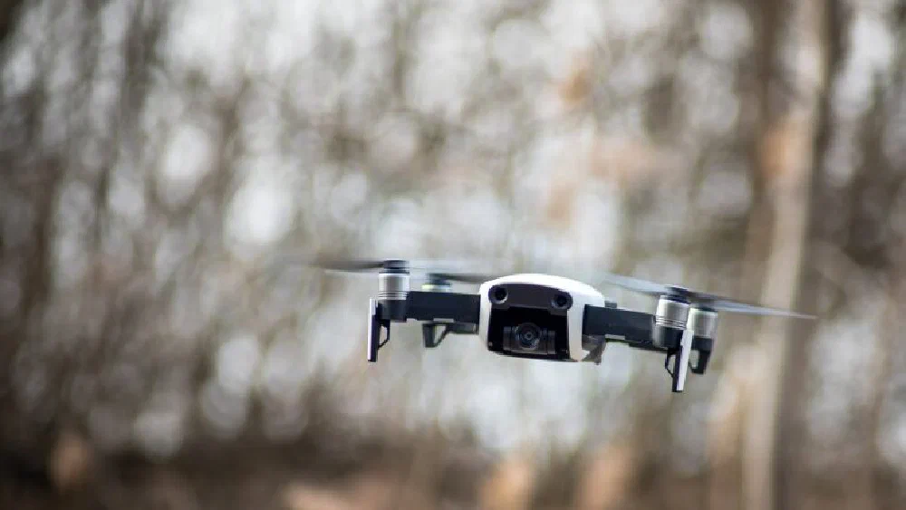 An autonomous drone in flight against an open sky